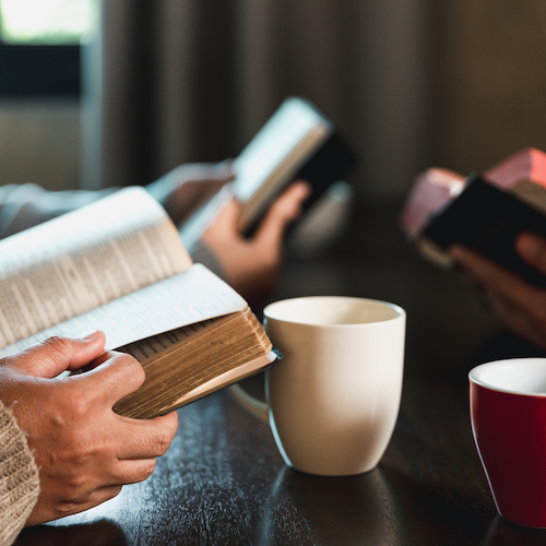 Small group of asian people praying worship believe. Teams of friends worship together before studying Holy bible. family praying together in church. Small group learning with prayer concept.